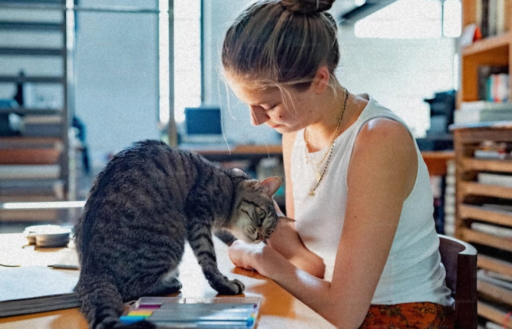 Generation Z young person playing with their cat