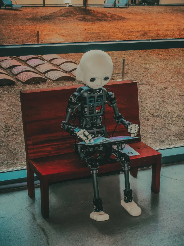 Ilustração de um robo sentado em um banco utilizando um tablet