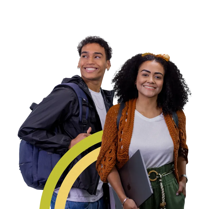 Trainees smiling and holding notebooks