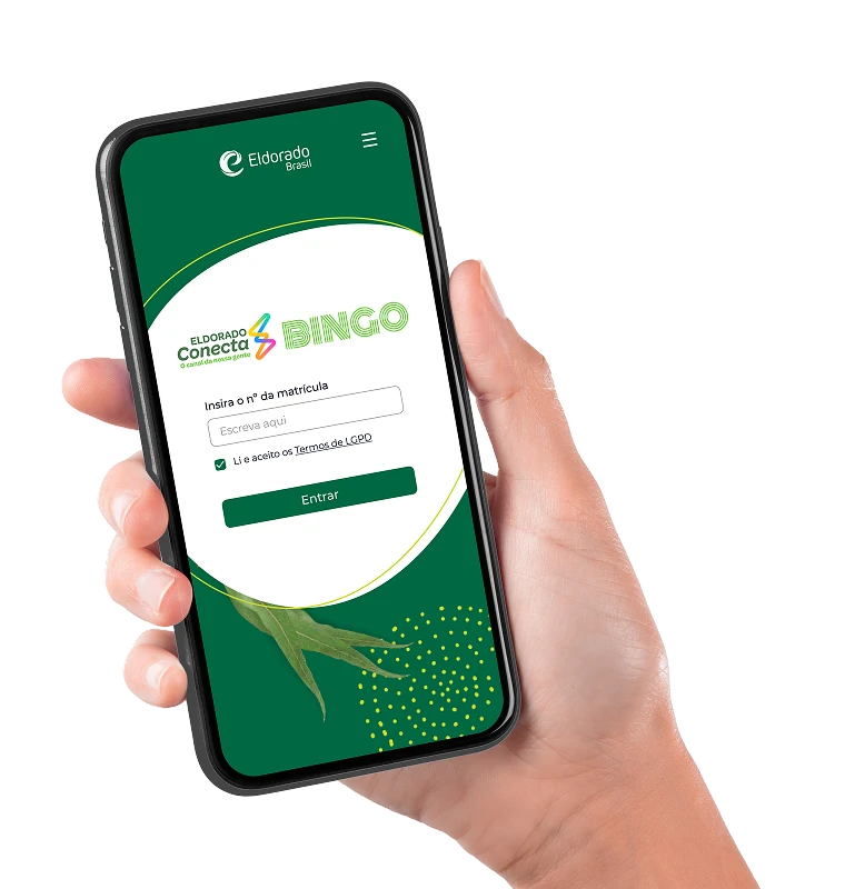Mão segurando um celular com o aplicativo do bingo da Eldorado